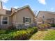 Attractive home exterior with stone accents, vibrant landscaping, and a well-maintained lawn at 10105 Grove Loop # D, Westminster, CO 80031