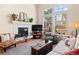 Living room features fireplace, large windows, and comfortable seating at 10105 Grove Loop # D, Westminster, CO 80031