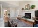 Cozy living room featuring fireplace, high ceilings and view to other rooms at 10105 Grove Loop # D, Westminster, CO 80031