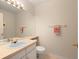 Classic powder room with tile floors, neutral tones, and a framed mirror at 10105 Grove Loop # D, Westminster, CO 80031