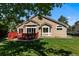Backyard featuring a deck with built-in seating, a lawn, and mature trees creating a private outdoor space at 9561 Silver Hill Cir, Lone Tree, CO 80124