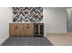 This basement wet bar features a beverage refrigerator and handsome decor at 9561 Silver Hill Cir, Lone Tree, CO 80124