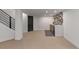 View of the finished basement showcasing the stairs, carpet, and built-in bar area at 9561 Silver Hill Cir, Lone Tree, CO 80124