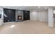 Spacious basement with neutral carpet, recessed lighting, and a cozy fireplace feature at 9561 Silver Hill Cir, Lone Tree, CO 80124
