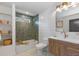 This stylish bathroom has open shelves, a tub, and a modern vanity at 9561 Silver Hill Cir, Lone Tree, CO 80124