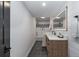 Modern bathroom featuring a vanity with a quartz countertop and a stylish tiled shower at 9561 Silver Hill Cir, Lone Tree, CO 80124