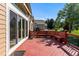 Home featuring a red-stained wood deck with built-in seating and beautiful backyard views at 9561 Silver Hill Cir, Lone Tree, CO 80124