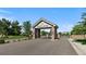 Community entrance with a decorative stone sign and gate, signaling entry into The Enclave neighborhood at 9561 Silver Hill Cir, Lone Tree, CO 80124