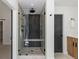 This glass shower has a built-in bench and pebble-lined floor at 9561 Silver Hill Cir, Lone Tree, CO 80124