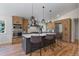Modern kitchen boasts stainless steel appliances, gray cabinetry, an island, and ample counter space at 9561 Silver Hill Cir, Lone Tree, CO 80124