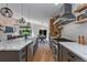 Spacious kitchen showcasing an island with seating, stainless appliances, and an open layout at 9561 Silver Hill Cir, Lone Tree, CO 80124