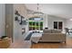 Bright living room with fireplace, large windows, hardwood floors, and comfortable seating area at 9561 Silver Hill Cir, Lone Tree, CO 80124