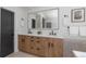 This bathroom vanity has plenty of drawers for storage and a modern black faucet at 9561 Silver Hill Cir, Lone Tree, CO 80124