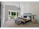 This main bedroom has large picture windows and an eye-catching black chandelier at 9561 Silver Hill Cir, Lone Tree, CO 80124