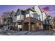 Modern two-story townhome with brick and gray siding at 1330 S Monaco Pkwy # 3, Denver, CO 80224