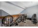 Loft area with exercise equipment and storage for bicycles at 1330 S Monaco Pkwy # 3, Denver, CO 80224