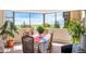Sunlit dining area with panoramic views and comfortable seating at 14001 E Marina Dr # 607, Aurora, CO 80014