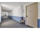 Hallway with unit number and decorated table with flowers at 14001 E Marina Dr # 607, Aurora, CO 80014