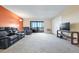 Inviting living room featuring comfortable seating, sliding glass doors, and ample natural light at 14001 E Marina Dr # 607, Aurora, CO 80014