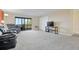Living room featuring comfy seating and a glass door to the balcony at 14001 E Marina Dr # 607, Aurora, CO 80014