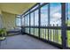 Inviting sunroom featuring a comfortable seating area and floor-to-ceiling windows offering expansive views of the outdoors at 14001 E Marina Dr # 607, Aurora, CO 80014
