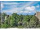 Scenic view featuring lush trees, blue skies, and distant mountains at 14001 E Marina Dr # 607, Aurora, CO 80014