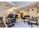 Spacious finished basement featuring a living area, dining set, and office space at 11357 Iola St, Commerce City, CO 80640