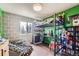 Bright bedroom featuring a unique loft bed, desk, and fun decor at 11357 Iola St, Commerce City, CO 80640