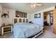 Comfortable bedroom with decorative wall art and a side table at 11357 Iola St, Commerce City, CO 80640