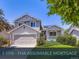 Charming two-story home featuring a covered porch, well-manicured lawn, and a two-car garage at 11357 Iola St, Commerce City, CO 80640
