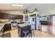 Modern kitchen with stainless steel appliances, ample counter space, and an island with seating at 11357 Iola St, Commerce City, CO 80640