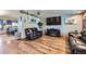 Spacious living room with hardwood floors, comfortable seating, and stylish decor at 11357 Iola St, Commerce City, CO 80640