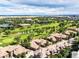 Aerial view of upscale homes near a golf course and airport at 10132 Inverness Main St, Englewood, CO 80112