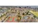 Aerial view of residential community, including a pool, clubhouse, tennis court and residential housing at 2925 S Vaughn Way, Aurora, CO 80014