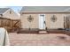 Cozy brick-paved backyard offers a low fence, landscaping, and a shed in the back at 2925 S Vaughn Way, Aurora, CO 80014