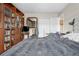 Bedroom featuring hardwood floors, large bookcases, and plenty of storage space at 2925 S Vaughn Way, Aurora, CO 80014