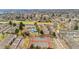 Community aerial view featuring a pool, clubhouse, tennis court and residential housing at 2925 S Vaughn Way, Aurora, CO 80014