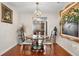 Stylish dining area with hardwood floors, and an open view into the living room and kitchen at 2925 S Vaughn Way, Aurora, CO 80014