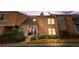 Charming townhome featuring a stucco exterior, well-maintained landscaping, and inviting front entrance at 2925 S Vaughn Way, Aurora, CO 80014