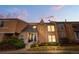 Charming townhome featuring a stucco exterior, well-maintained landscaping, and inviting front entrance at 2925 S Vaughn Way, Aurora, CO 80014