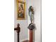 Hallway with statue and a floral painting on the wall at 2925 S Vaughn Way, Aurora, CO 80014