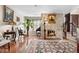 Cozy living room featuring a stone fireplace, hardwood floors, and decor that enhances its inviting atmosphere at 2925 S Vaughn Way, Aurora, CO 80014