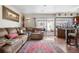 Spacious living room provides access to the backyard through a sliding door at 2925 S Vaughn Way, Aurora, CO 80014