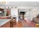 Kitchen island leads to a fireplace, sofa, and stairwell in the living space at 2925 S Vaughn Way, Aurora, CO 80014