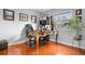 Home office with hardwood floors, a vintage desk, and natural light from the window at 2925 S Vaughn Way, Aurora, CO 80014