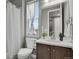 Bathroom with a combination shower and tub as well as a window with natural light at 23615 E 5Th Pl, Aurora, CO 80018