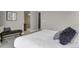 Modern bedroom features neutral walls and a patterned shower room beyond the sleeping area at 23615 E 5Th Pl, Aurora, CO 80018