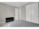 Bedroom with sliding closet doors and neutral gray walls, as well as a stylish accent chair at 23615 E 5Th Pl, Aurora, CO 80018