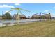 Community pool with splashpad feature, complete with covered seating area and mature trees at 23615 E 5Th Pl, Aurora, CO 80018
