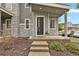 Inviting front entrance of a two-story home featuring stone accents, and a well-kept lawn and garden at 23615 E 5Th Pl, Aurora, CO 80018